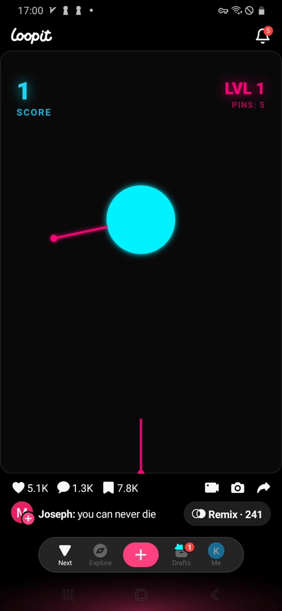 Loopit Pin Launch with several pink pins attached to the blue ball.